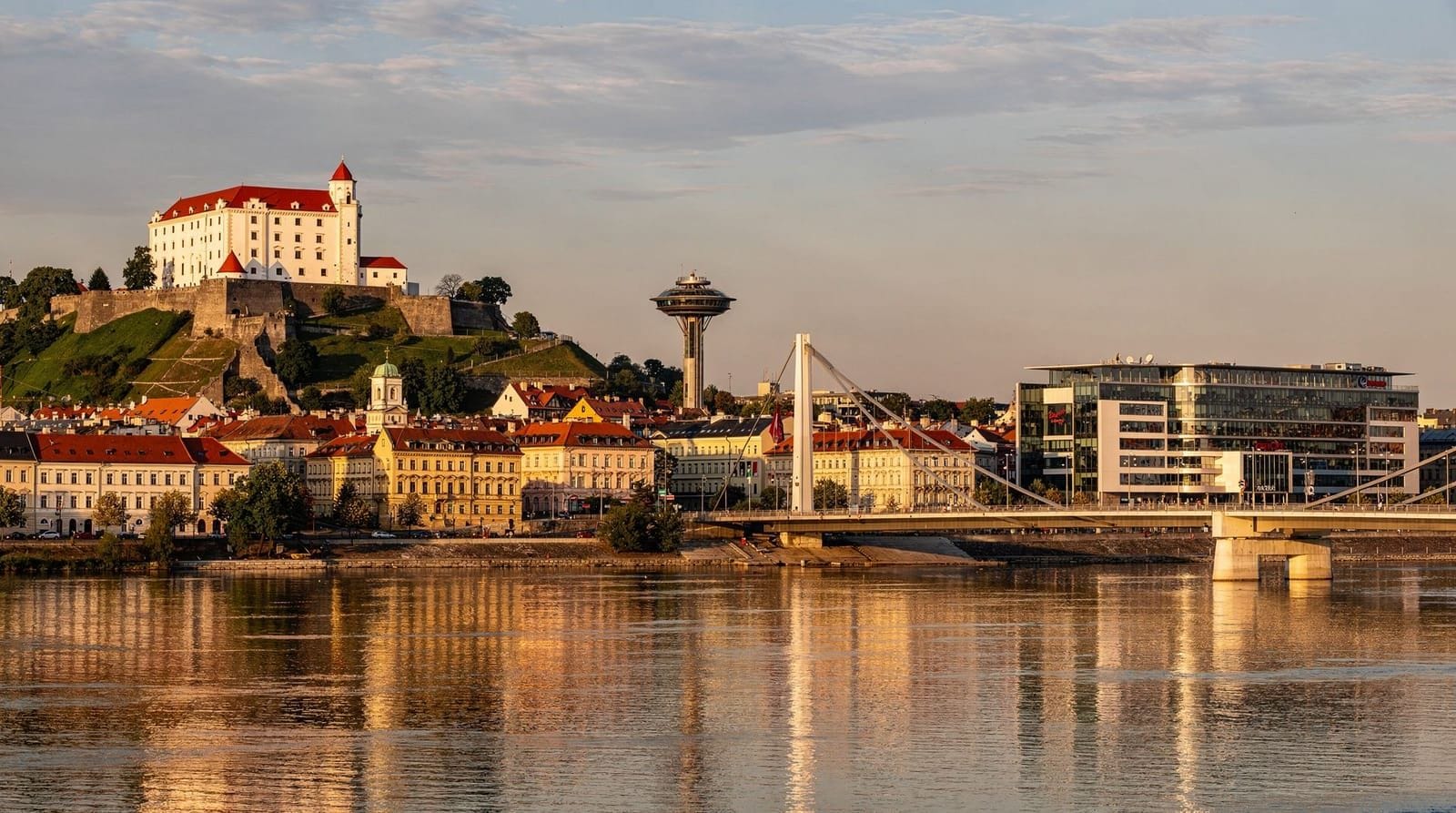 Bratislava old town and castle reflected in the Danube at dusk